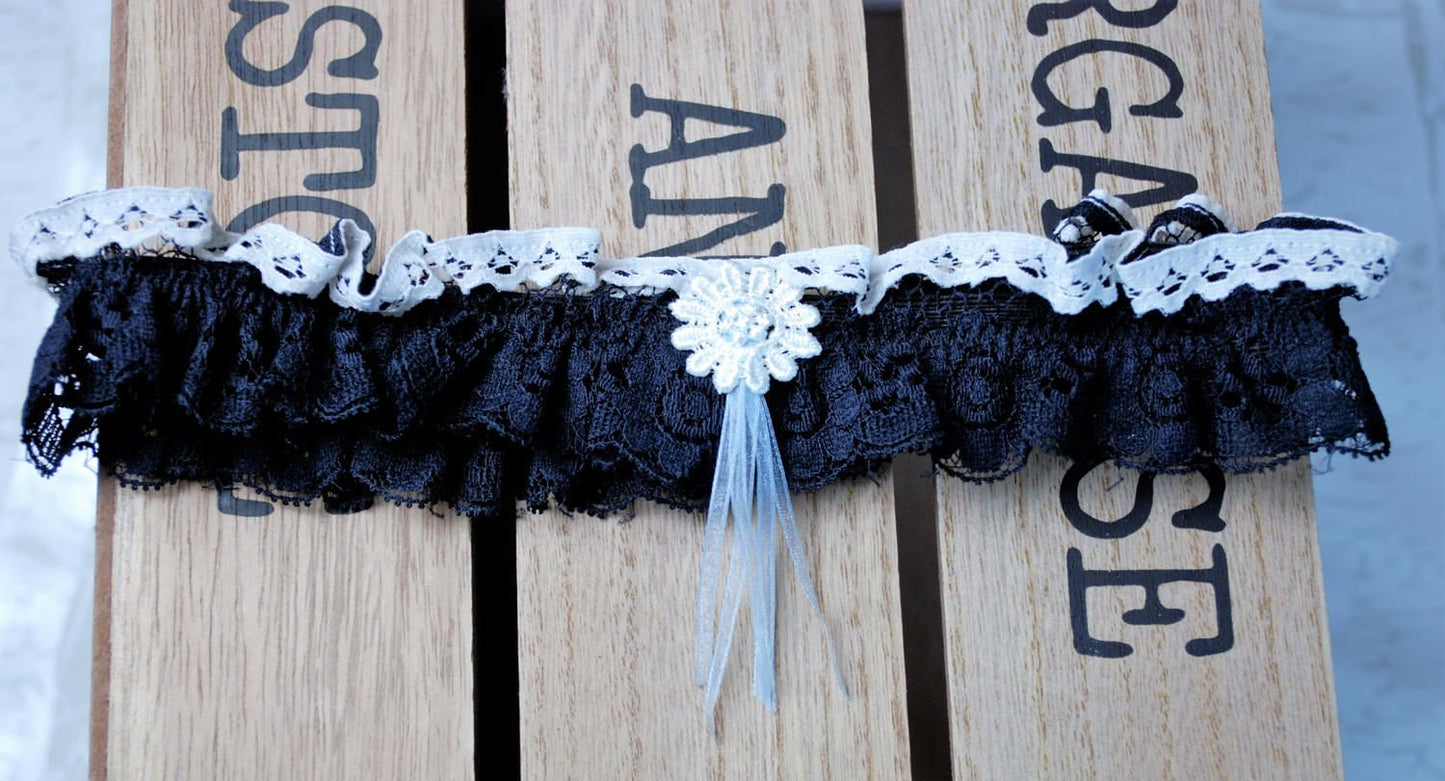 Navy blue lace bridal garter accessory.