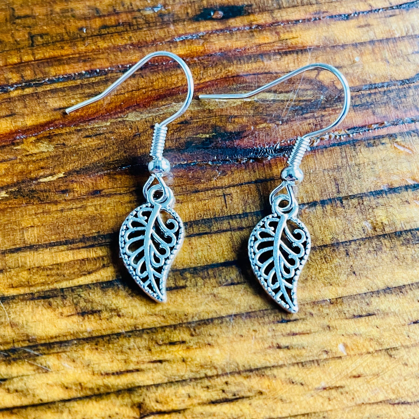 Leaf shaped charm pierced earrings