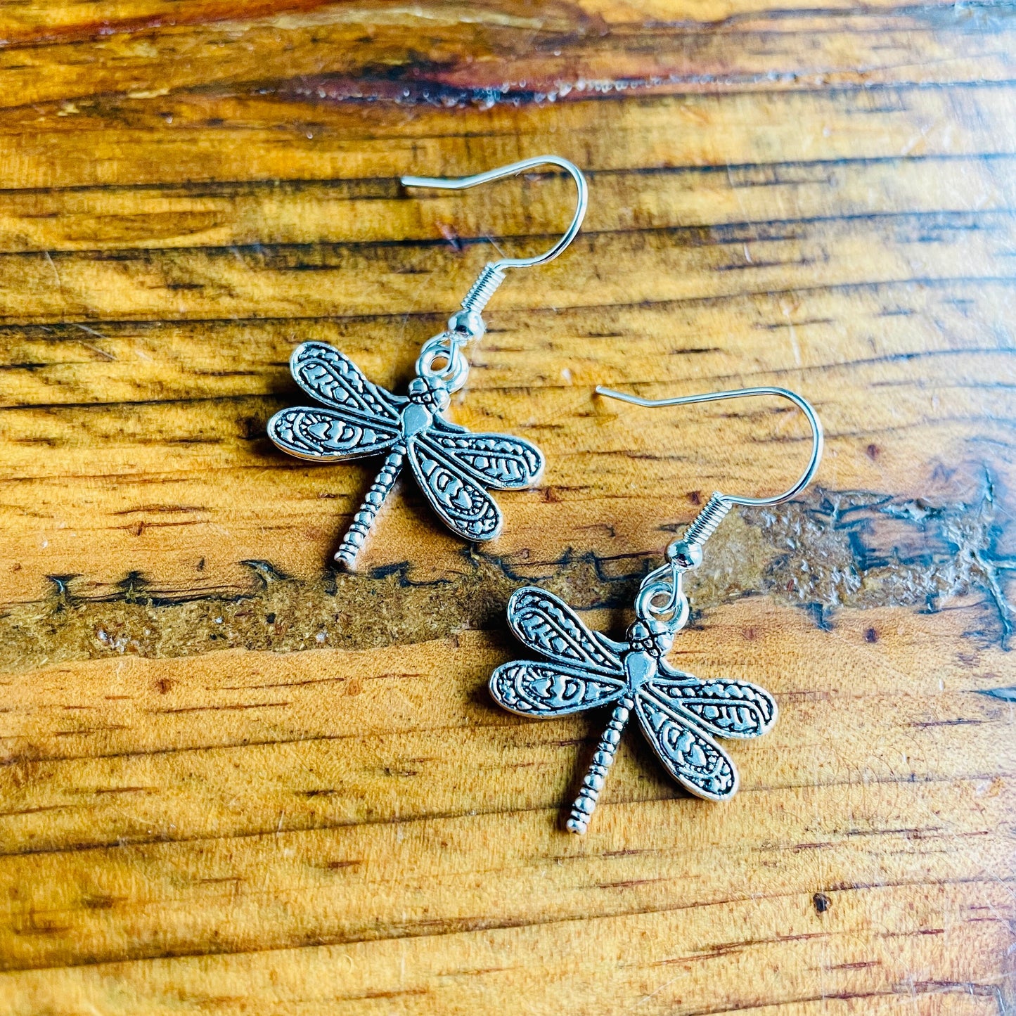 Dragonfly shaped charm pierced hypoallergenic earrings