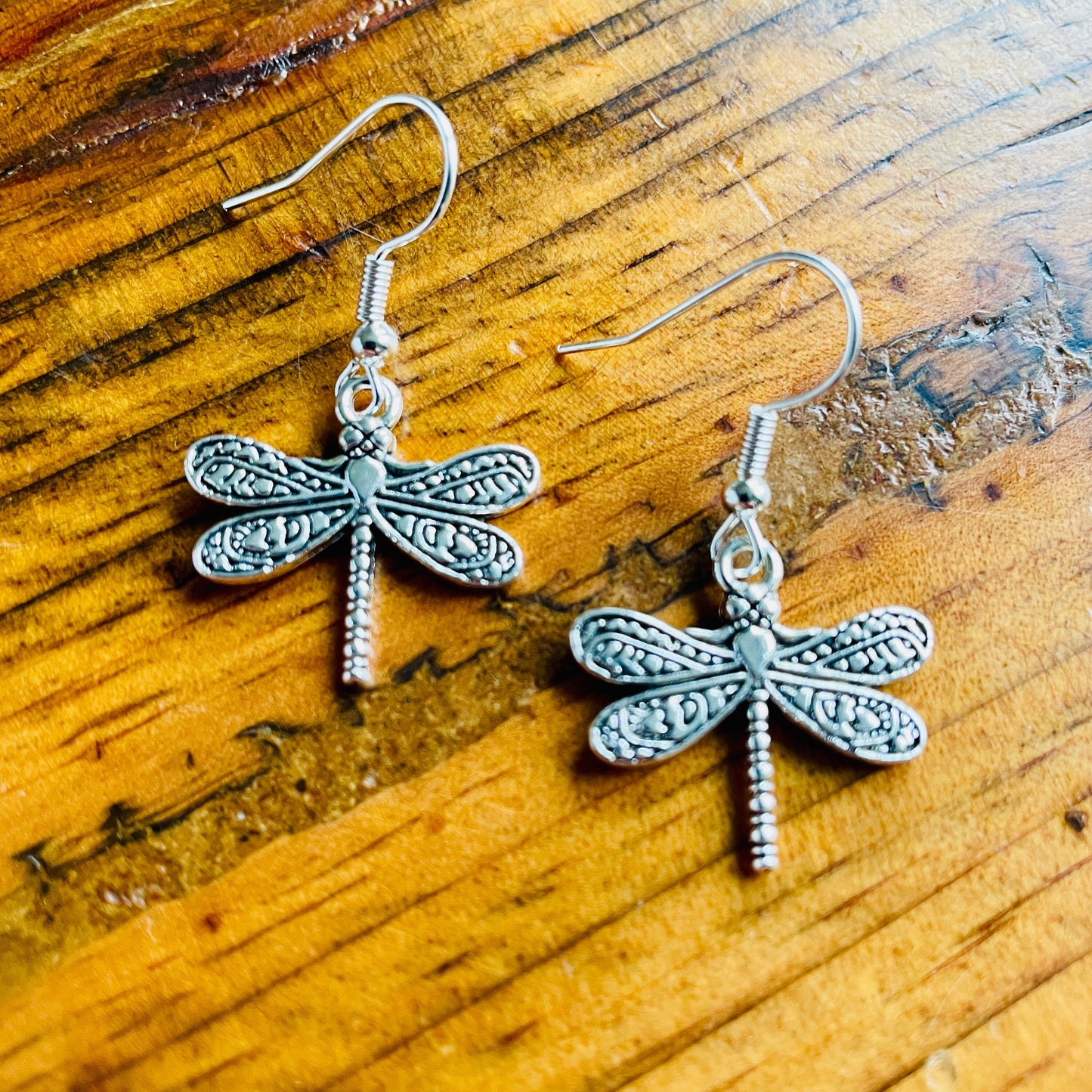 Dragonfly shaped charm pierced hypoallergenic earrings