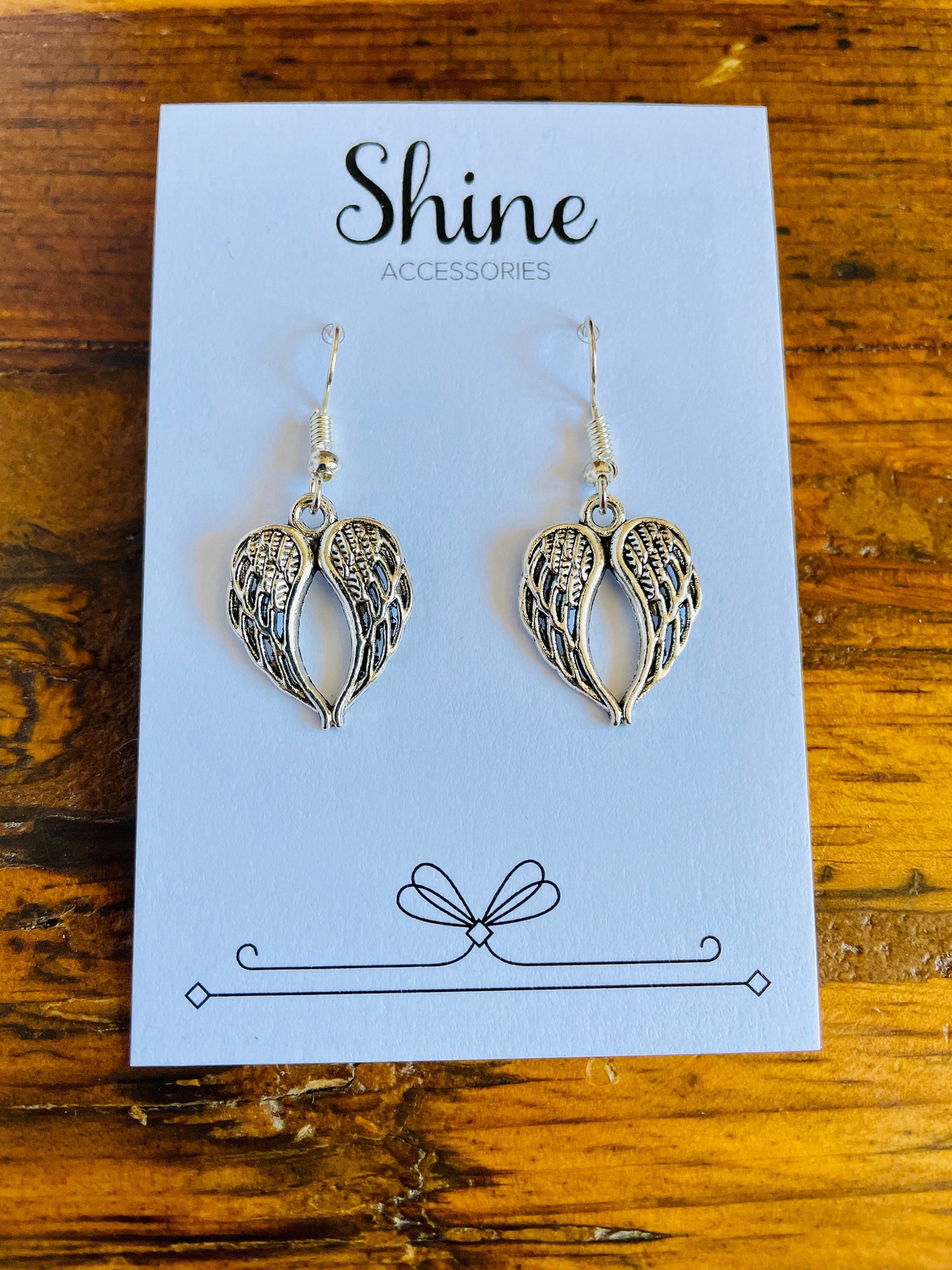 Angel wing shaped charm pierced earrings