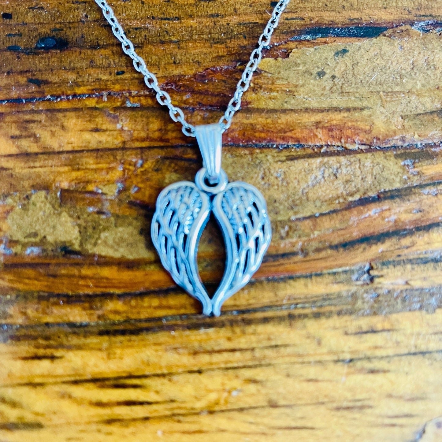 Angel wing shaped charm necklace