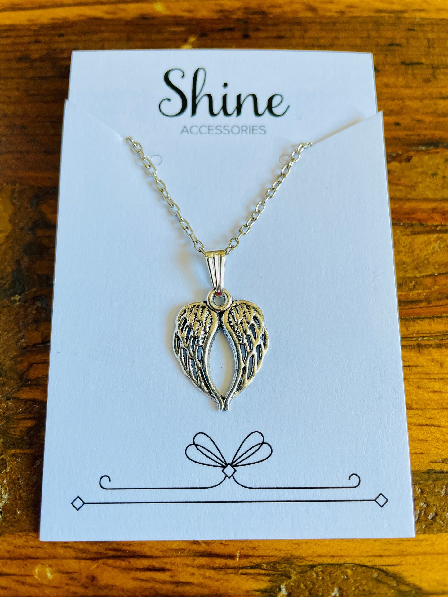 Angel wing shaped charm necklace