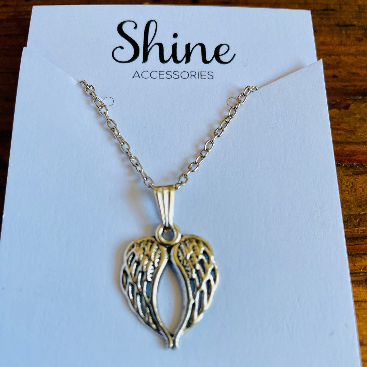 Angel wing shaped charm necklace