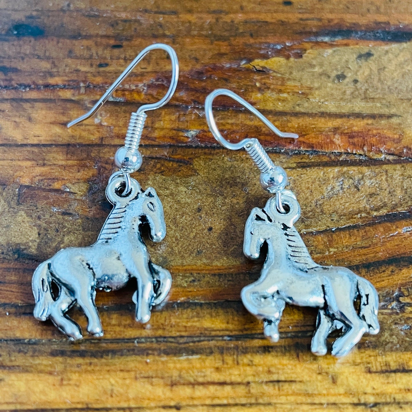 Horse shaped charm pierced earrings