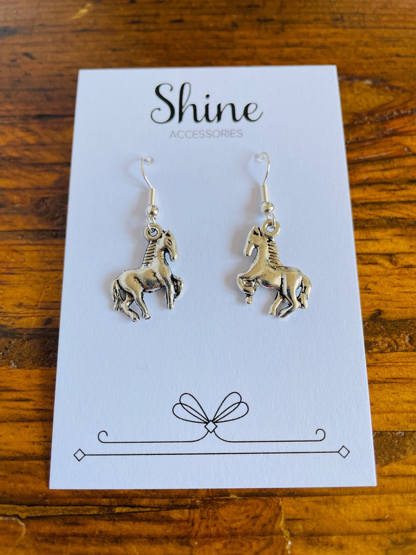 Horse shaped charm pierced earrings